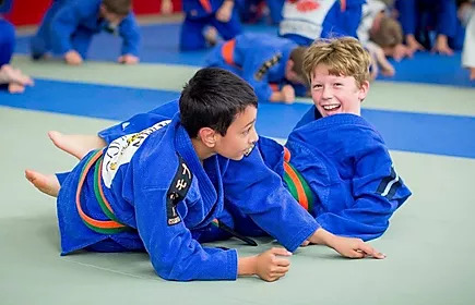 Children participating in a school judo session