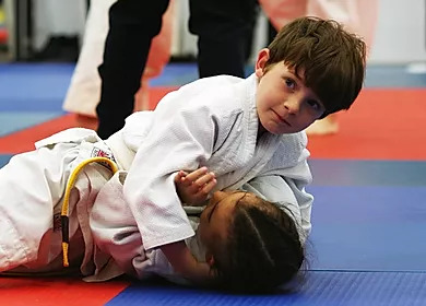 Children participating in a school judo session